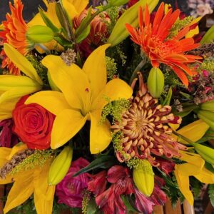 Thanksgiving centerpiece with mixture of novelty and standard flowers