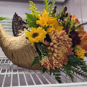 Small Thanksgiving centerpiece with mixture of novelty and standard flowers